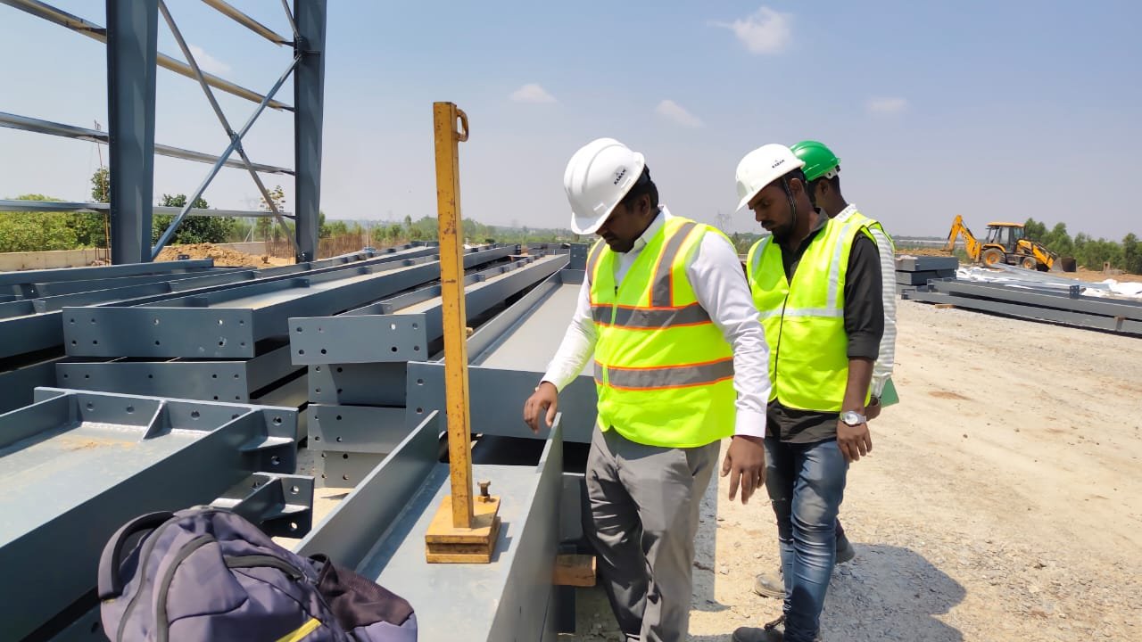 Engineer inspecting metal structure stability